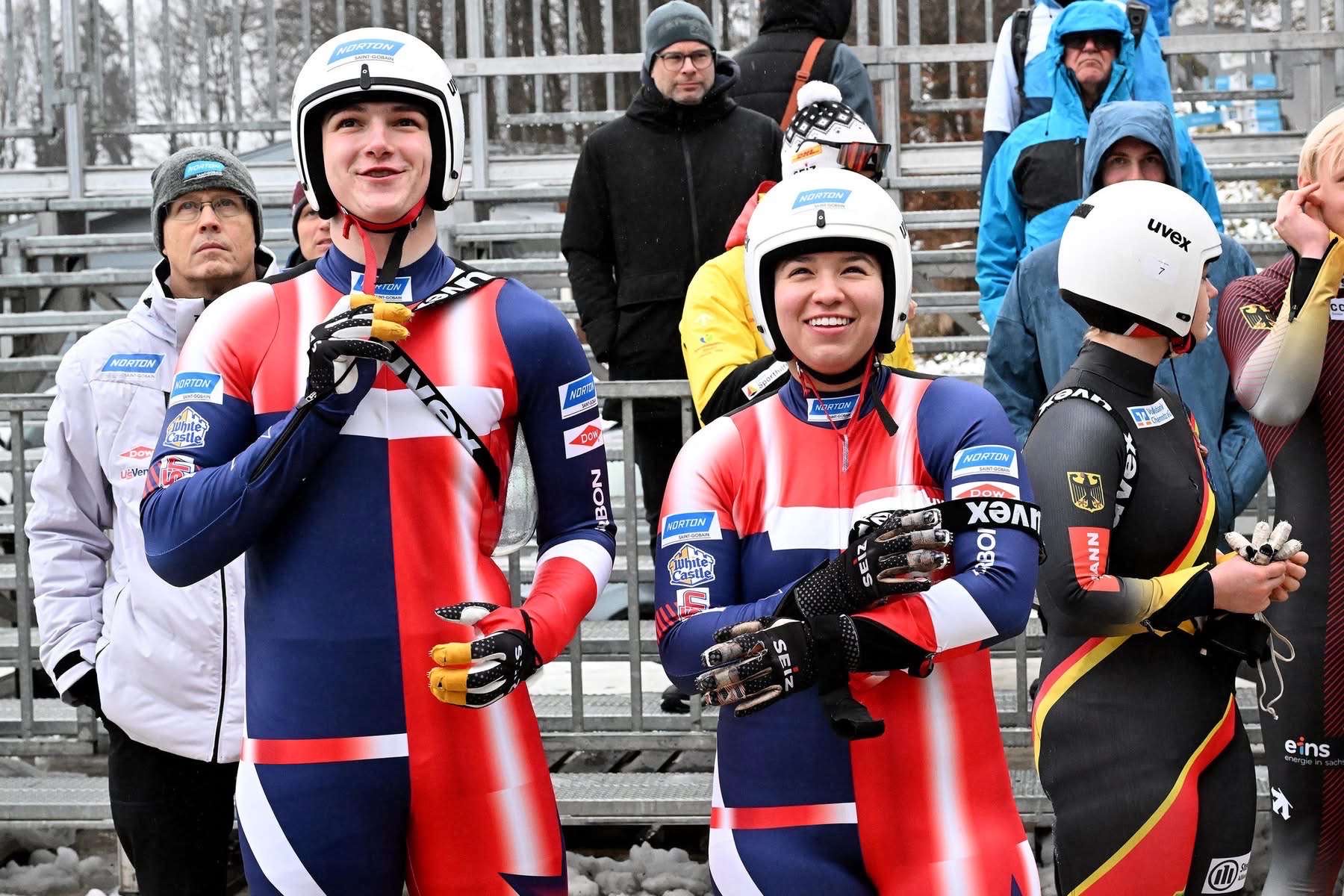 Logan at podium ceremony with international competitors